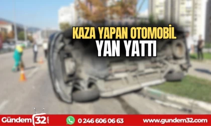 Kaza yapan otomobil yan yattı