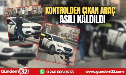 Kontrolden çıkan araç asılı kaldı